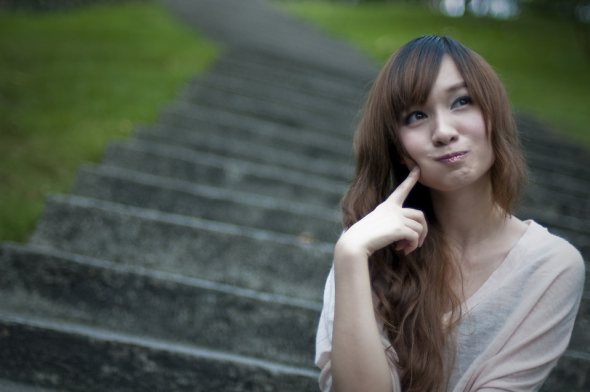 9382-a-beautiful-chinese-girl-sitting-on-steps-making-a-silly-face-pv.jpg